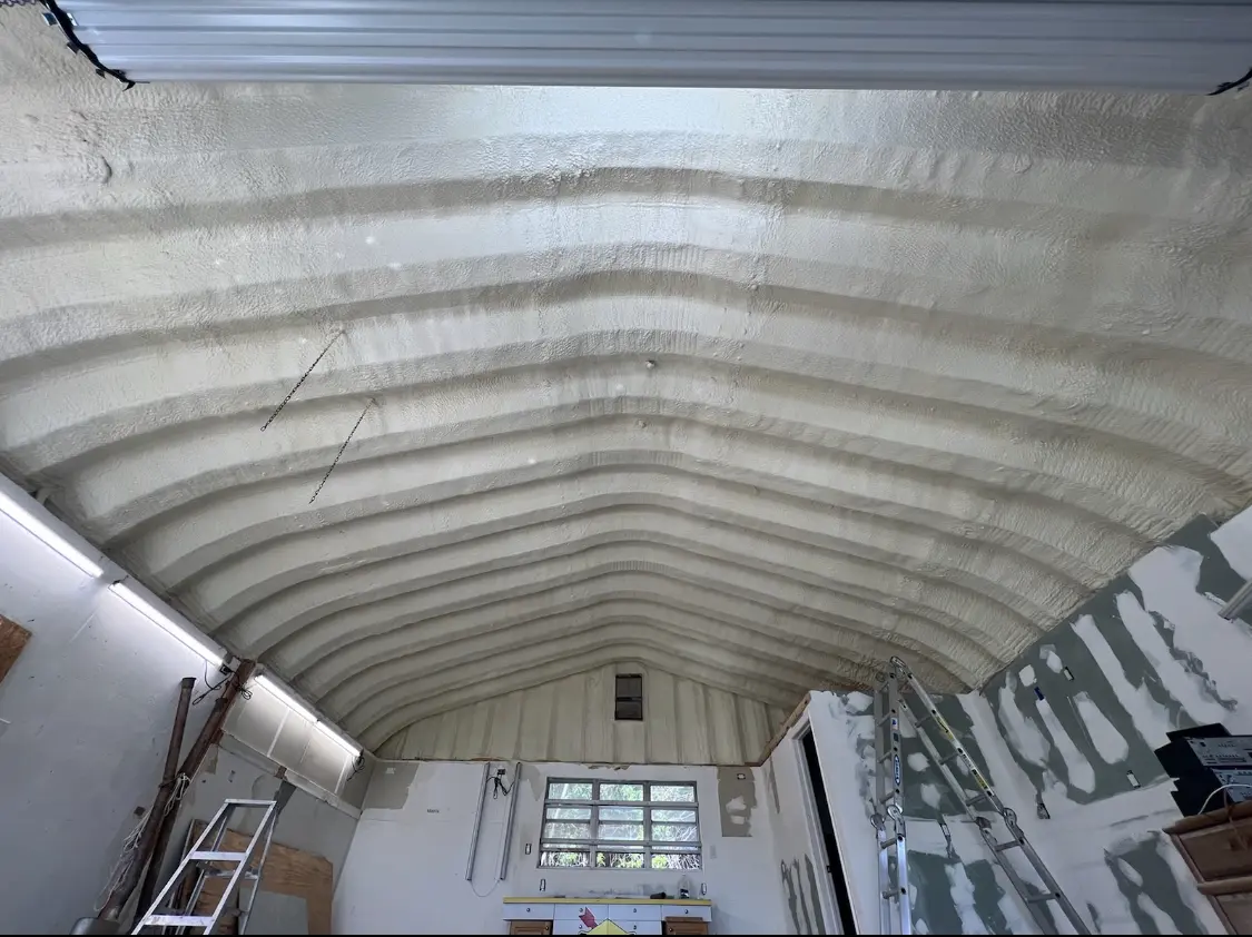 Spray polyurethane foam applied to the underside of a metal roof deck in Ashwaubenon